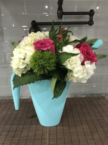 Rustic Farmhouse in a watering can, flowers